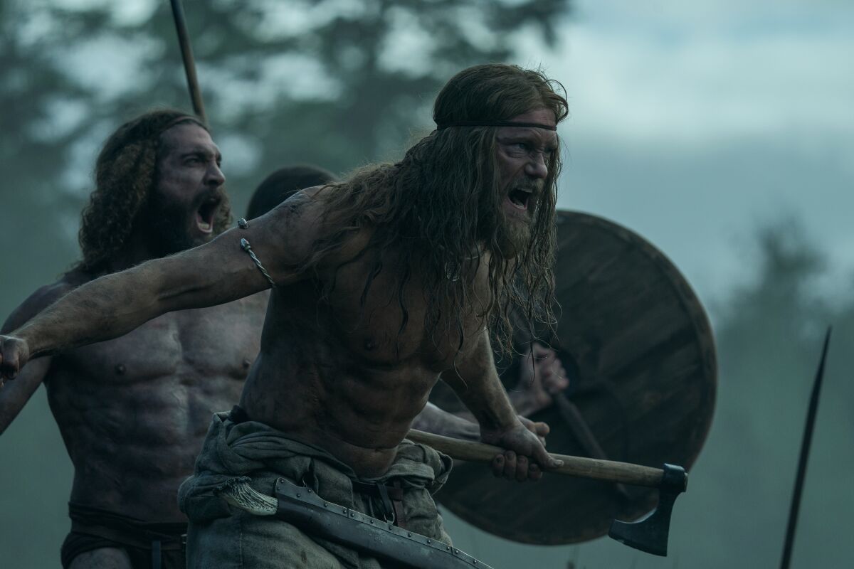 Vikings yell and run into battle.