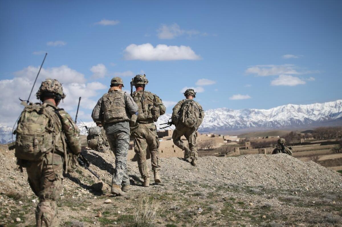 U.S. Army soldiers patrol an area in Afghanistan last year. Researchers say they have devised an algorithm that predicts which soldiers are at the greatest risk of committing a violent crime.