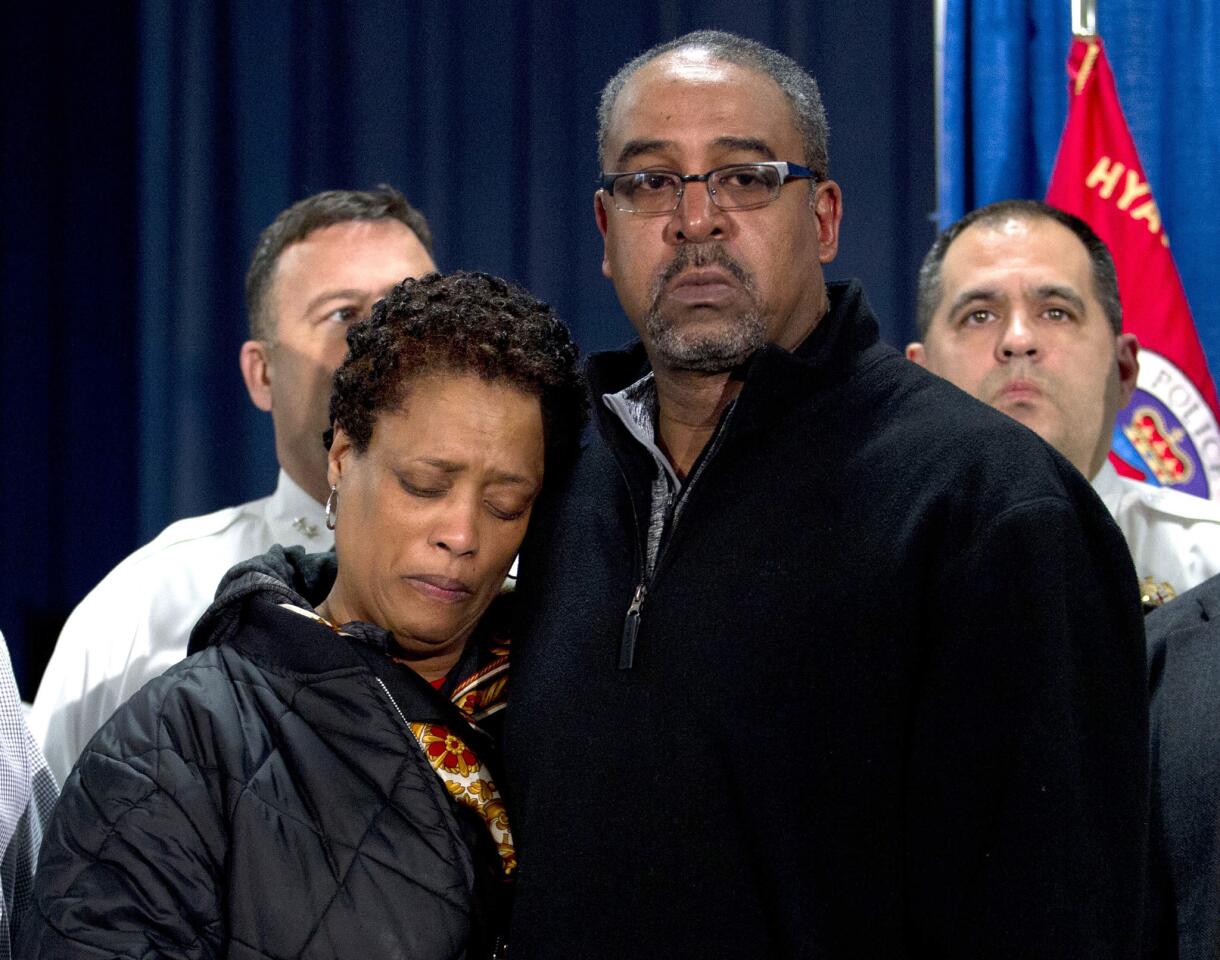 The parents of police officer Jacai Colson, James and Sheila Colson attend a news conference at Prince George's County Police headquarters.
