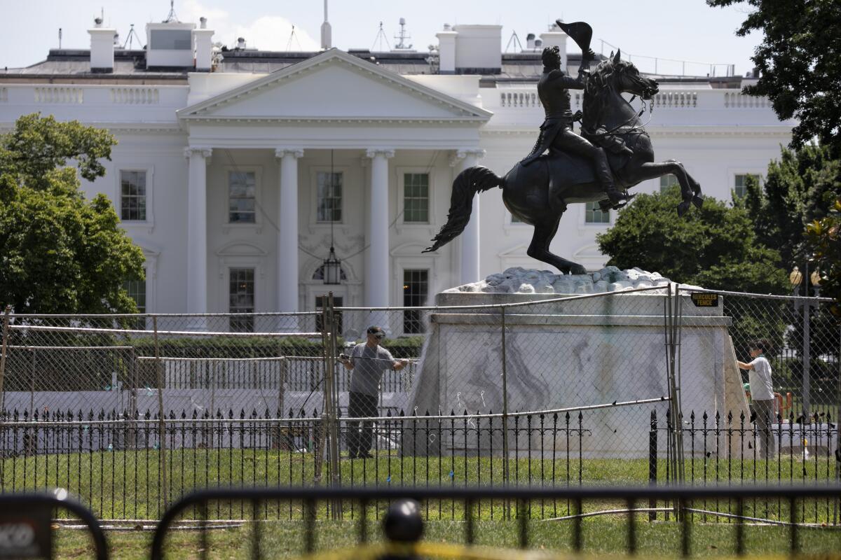 The President Andrew Jackson statue is washed in Lafayette Park on June 24.