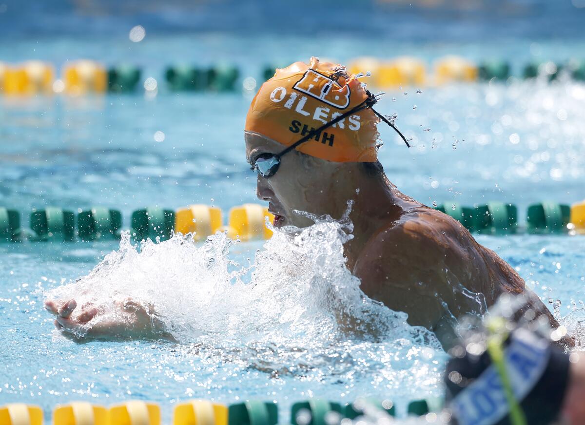 Kyle Shih of Huntington Beach, swims the breaststroke leg of the boys' IM relay.