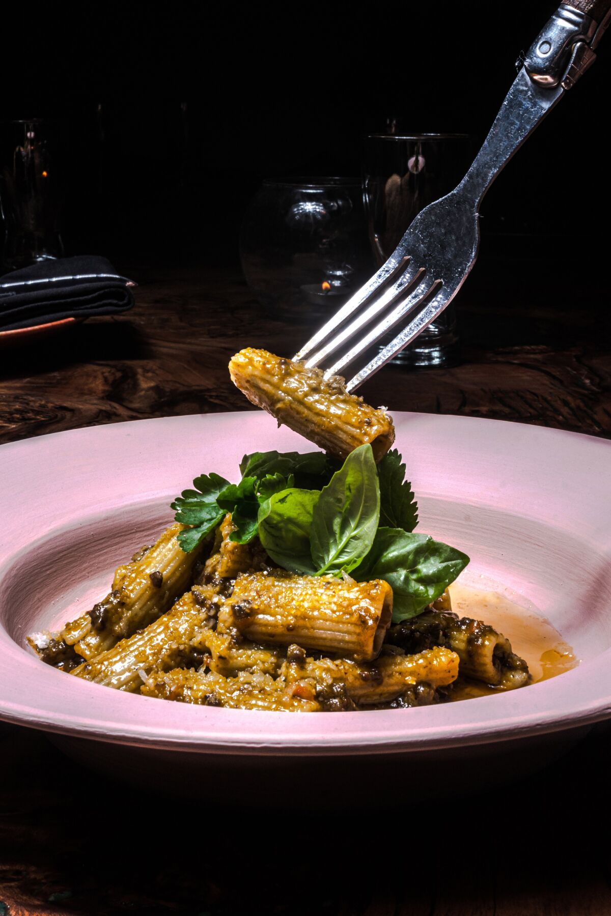 A fork lifts rigatoni in verde sauce at Ricardo Zarate and Michael Fiorelli's new Colibrí pop-up in West Hollywood.