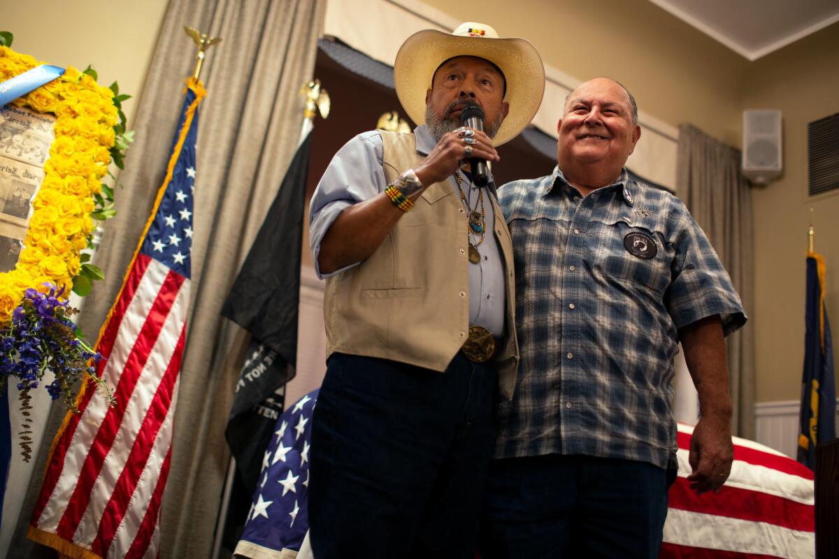 Pastor Joe Enriquez. left, became a strong spiritual presence for Ruben Valencia, whose best friend died serving in Vietnam in 1967.