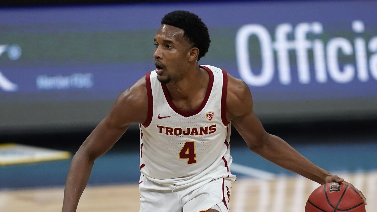 USC's Evan Mobley controls the ball during a win over Utah in the Pac-12 tournament on Thursday.