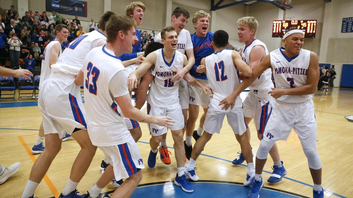 The Pomona-Pitzer Sagehens celebrate their win over the Occidental Tigers in the Southern California Intercollegiate Athletic Conference championship game Feb. 23 at Voelkel Gym.