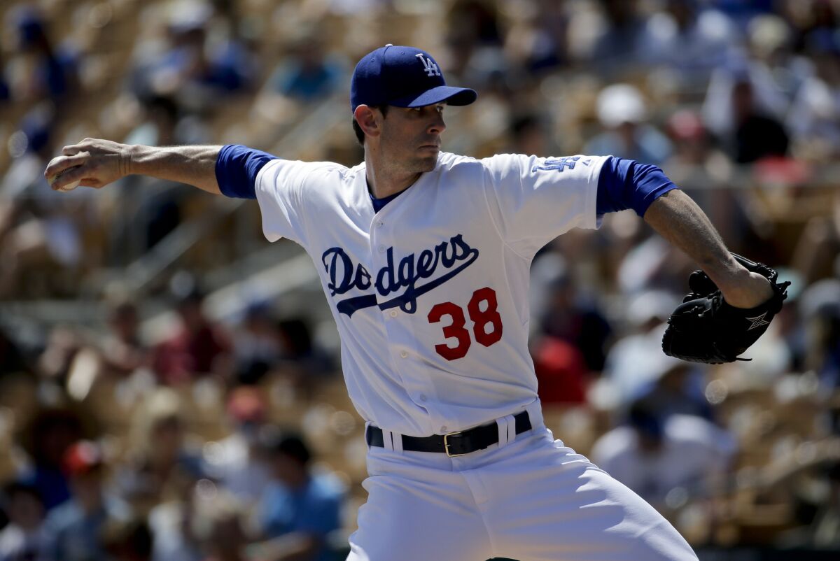 Dodgers starting pitching Brandon McCarthy throws against the Texas Rangers in Sunday's spring training exhibition.
