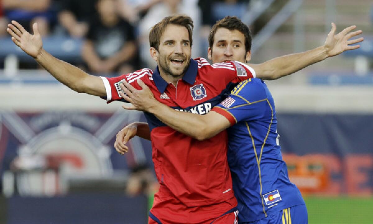 Chicago midfielder Mike Magee, front, battles Colorado midfielder Nathan Sturgis for position during a match in June. Magee, Major League Soccer's reigning MVP, is out to prove he deserves a spot on the U.S. World Cup squad.