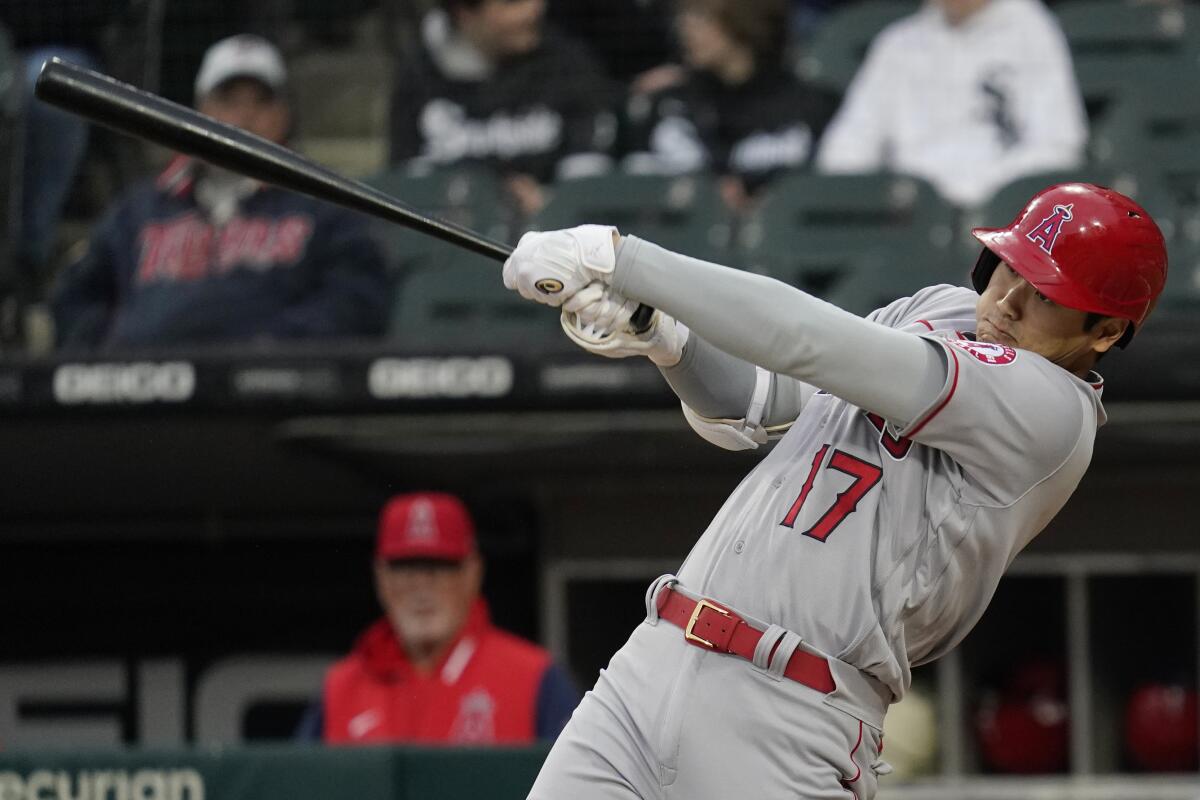 Los Angeles Angels' Shohei Ohtani, of Japan, hits a solo home run during the first inning.