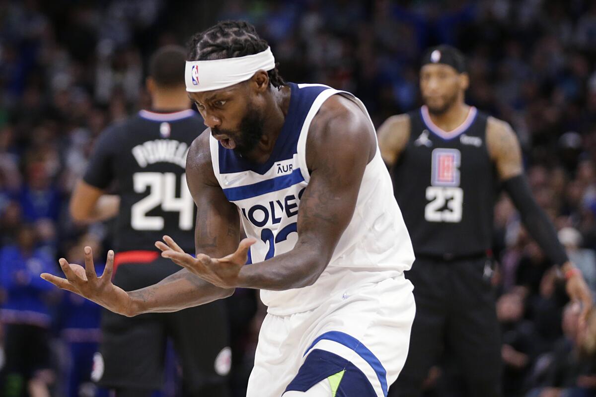 Timberwolves guard Patrick Beverley looks at his hands after a foul call against the Clippers.