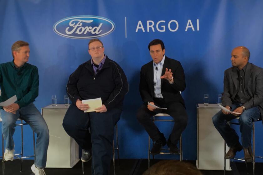 From left: Argo AI Chief Operating Office Peter Rander and Chief Executive Bryan Salesky, the firm's founders, with Ford CEO Mark Fields and Chief Technical Officer Raj Nair as they announce their partnership in San Francisco on Friday.
