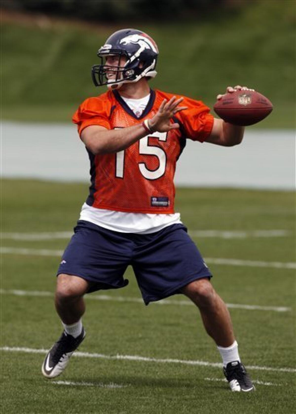 Tebow dons Broncos jersey for 1st time - The San Diego Union-Tribune