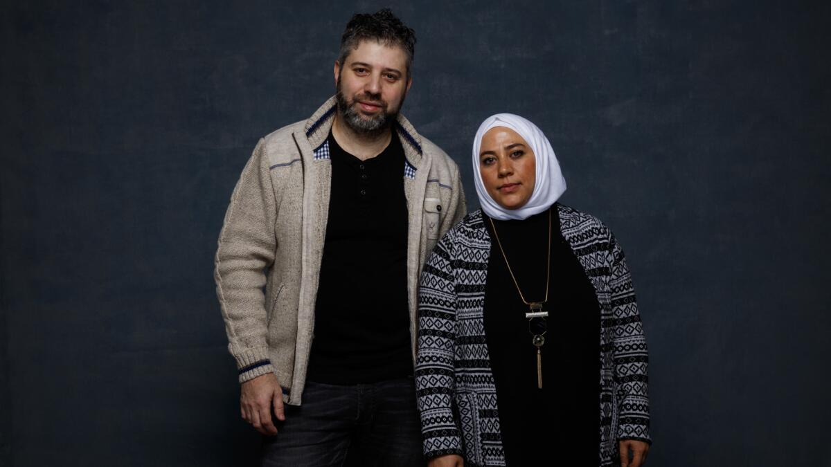 Director Evgeny Afineevsky and subject Kholoud Helmi from the documentary film "Cries From Syria" attend the 2017 Sundance Film Festival in Park City, Utah.