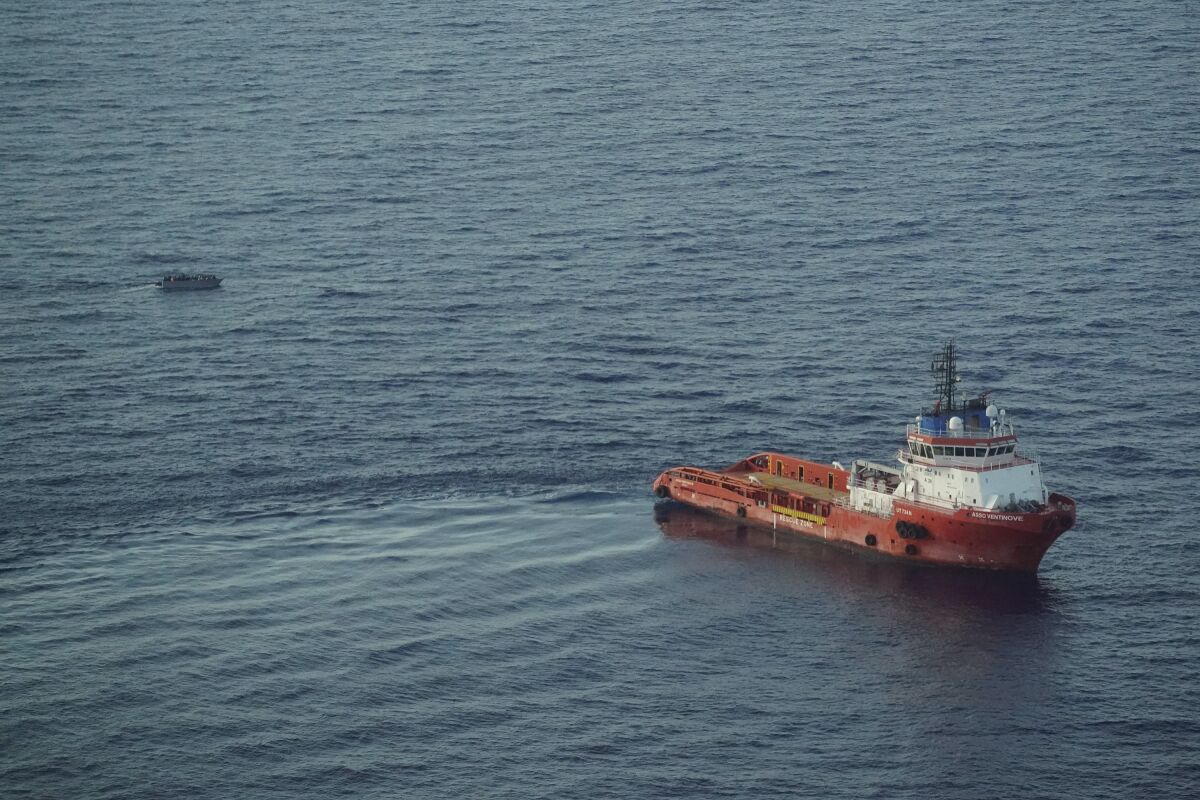 The Italian supply vessel, Asso Ventinove is seen from aboard the Seabird, an NGO aircraft, as it prepares to rescue persons from aboard a migrant boat drifting in the central Mediterranean Sea near the Bouri oilfields north of Libya, Saturday, Oct. 2, 2021. The offshore supply vessel on Saturday rescued dozens of migrants, including women and children, fleeing Libya to Europe on a crowded, wooden boat. (AP Photo/Renata Brito)