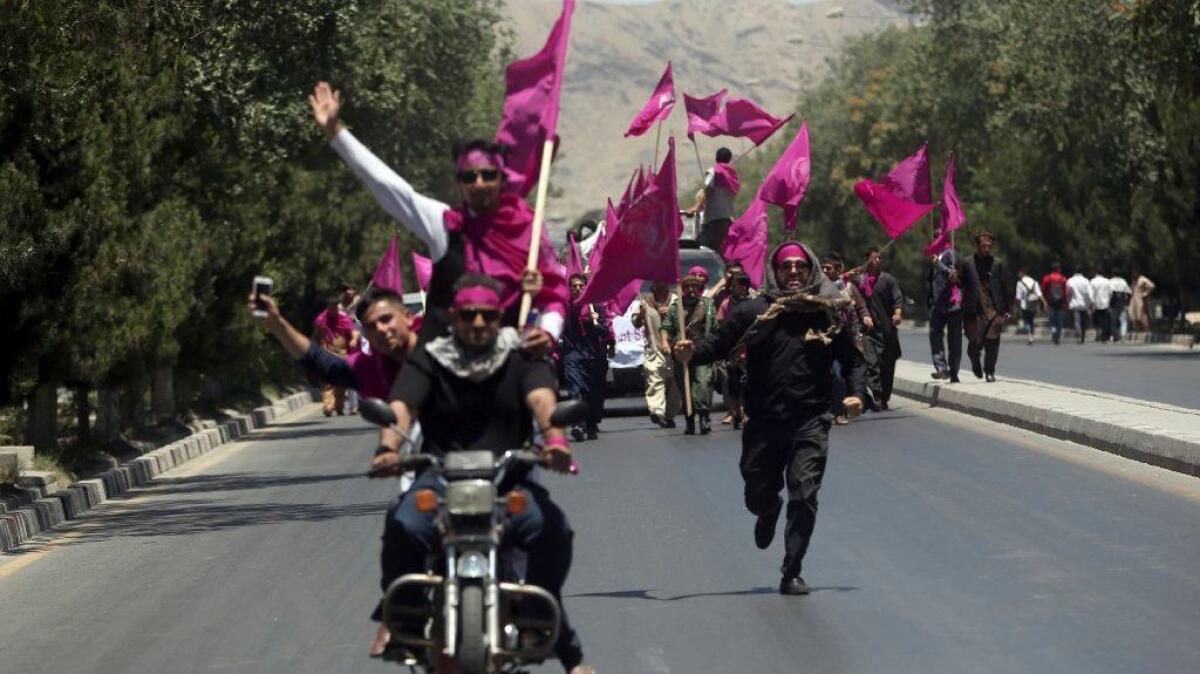 Protesters shout anti-government slogans during a demonstration in Kabul on Monday.