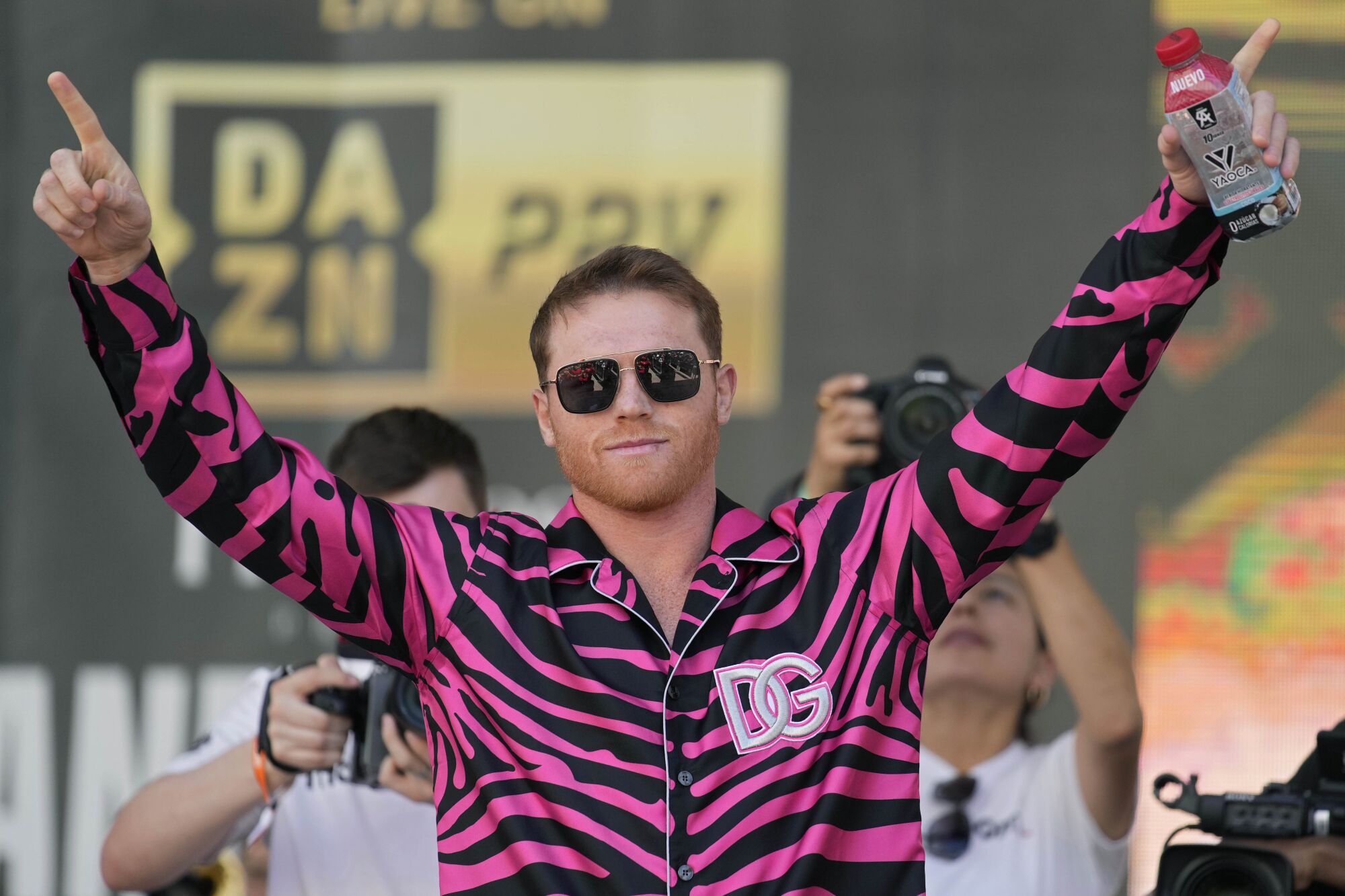 Canelo Álvarez motions to the crowd during a ceremonial boxing weigh-in Friday in Las Vegas