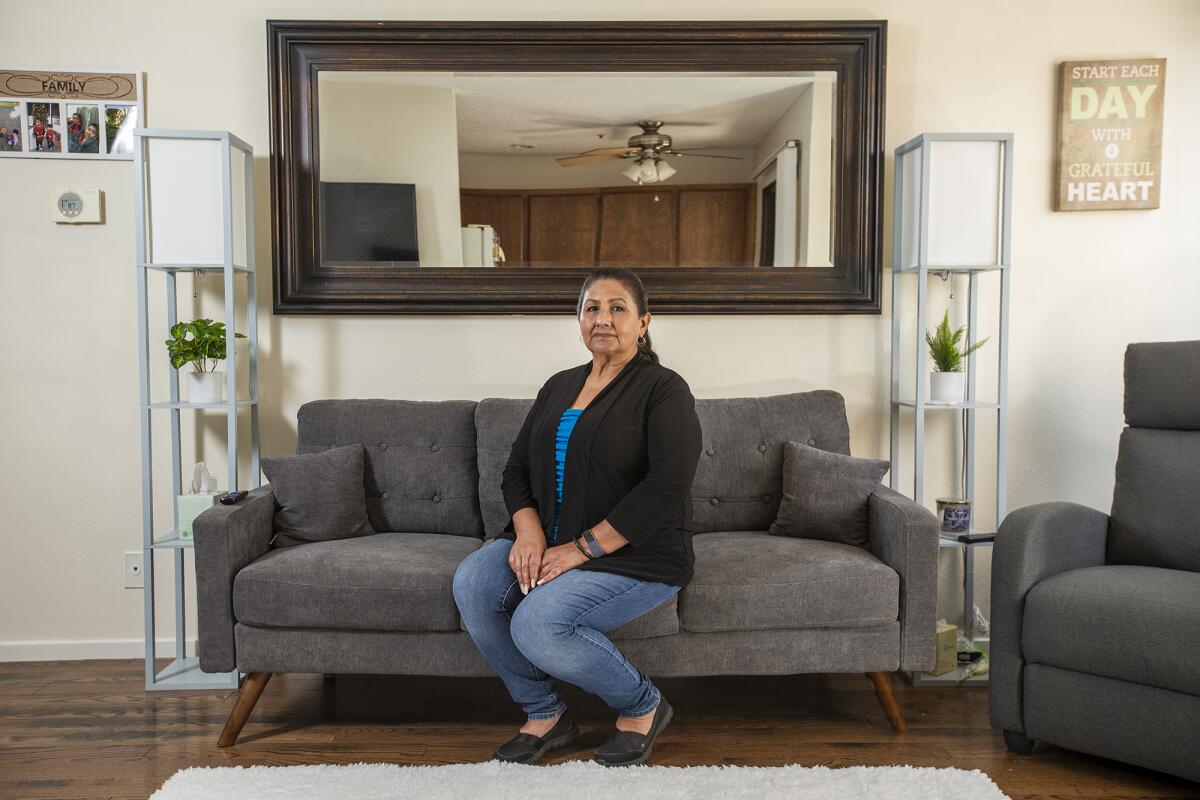Dolores Canales sits in her home in Fullerton.