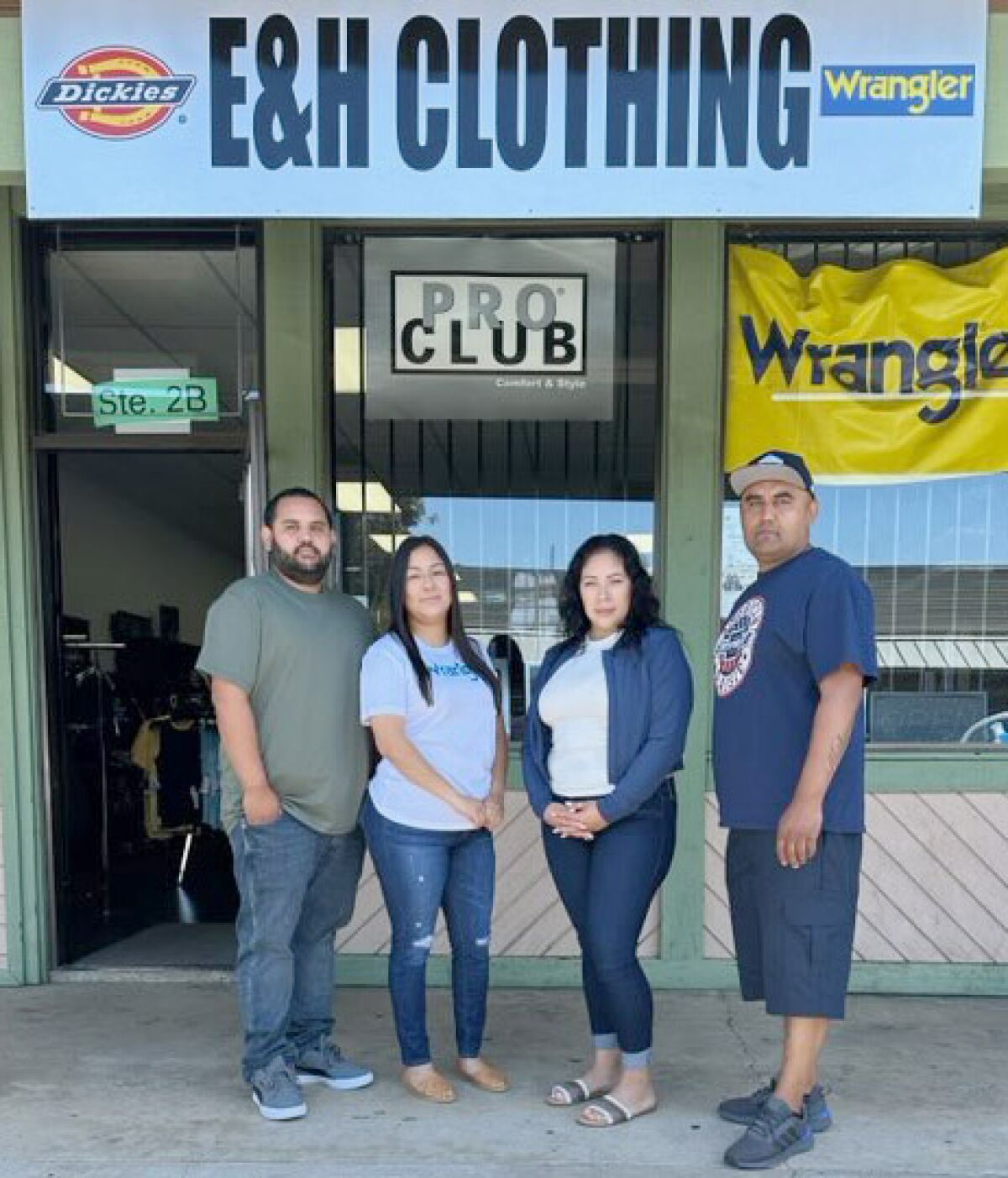 E & H Clothing owners are, from left, Hector Altamirano and Yuri Altamirano, and Guadalupe Hernandez and Eddie Hernandez.