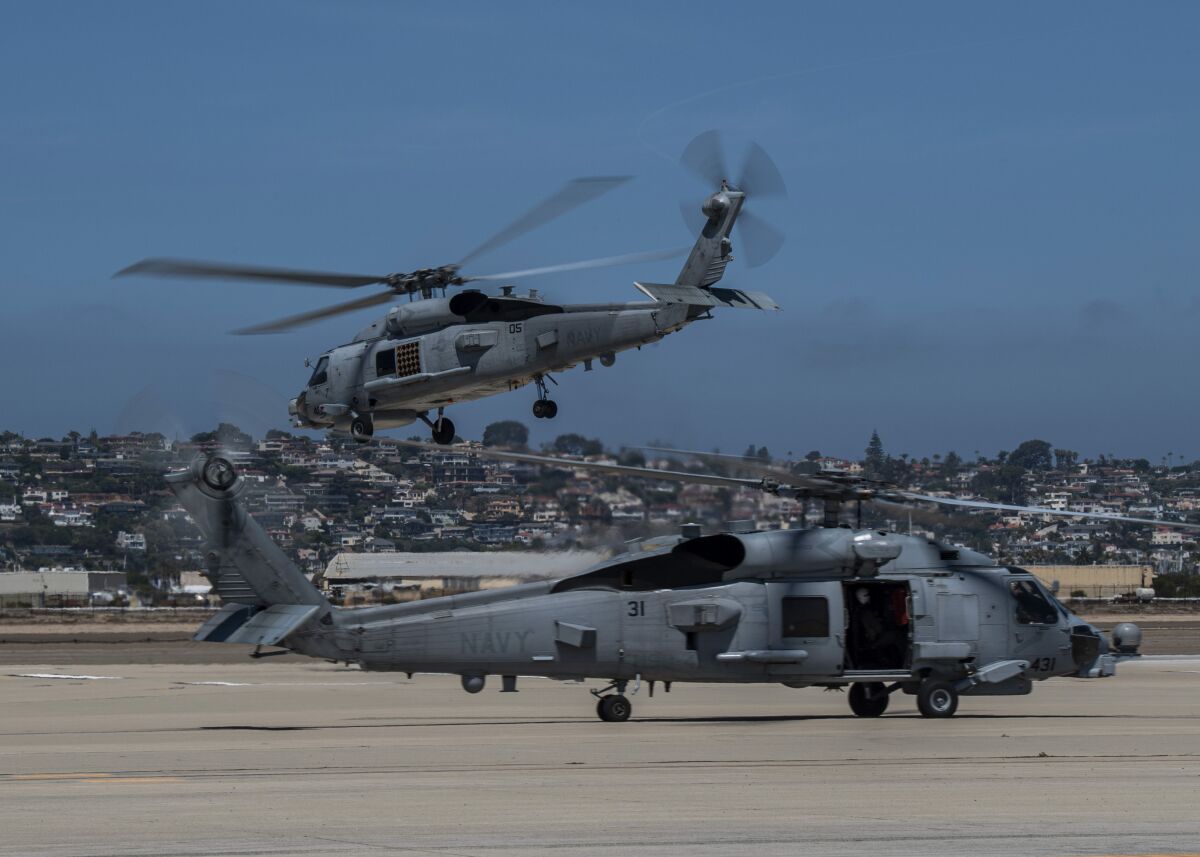 An MH-60R Sea Hawk helicopter takes off during a flight in August.