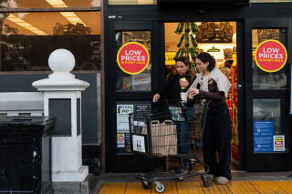 People leave Ralphs with their groceries in West Hollywood.