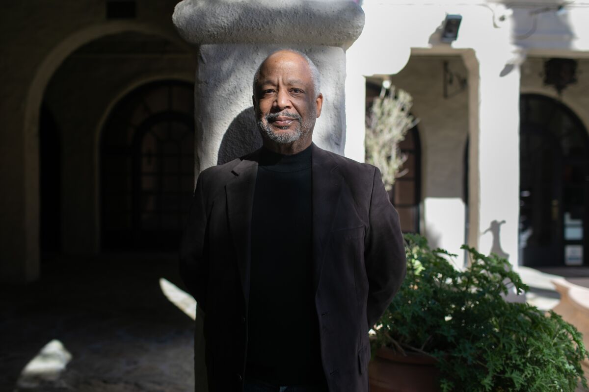 Sheldon Epps stands in the Pasadena Playhouse courtyard.