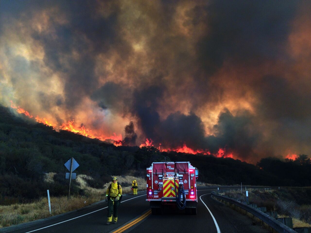 The Ortega Highway was closed after the fire jumped the road. Dozens of homes were ordered evacuated.