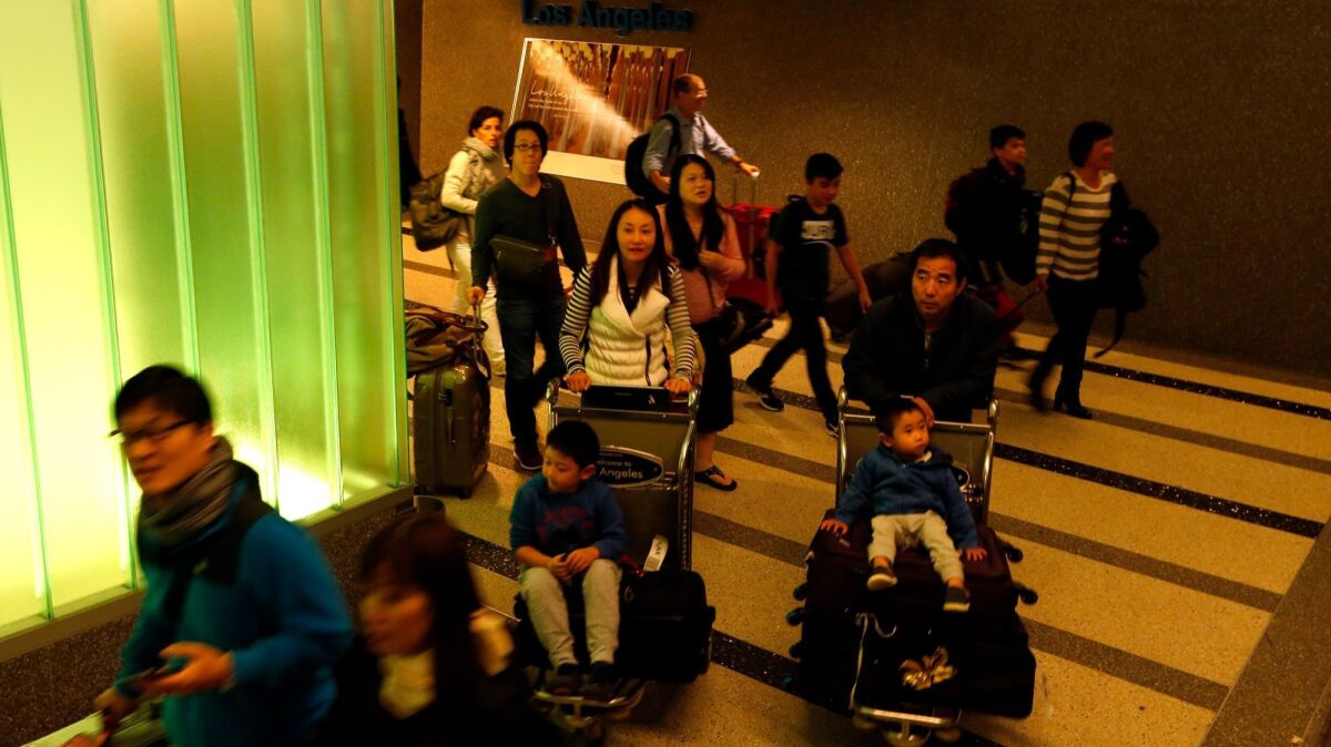 Passengers, who traveled on Air China Flight CA987, arrive at Tom Bradley International Terminal at LAX. In 2015, the State Department issued 2.27 million visas to Chinese tourists. It does not track what proportion of visas are issued to birth tourists.