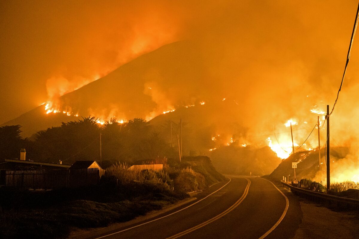 The Colorado fire burns along the Pacific Coast Highway near Big Sur on Saturday.