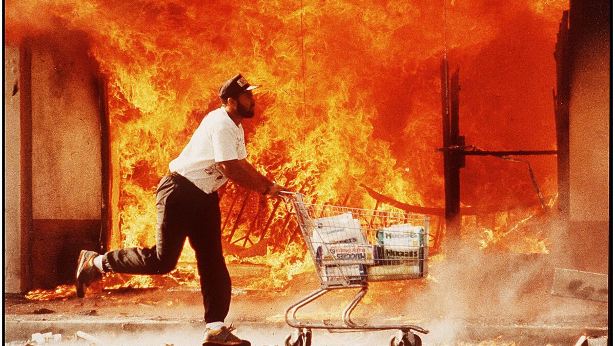 A scene from the 1992 riots, with Los Angeles at a low point after the police beating of Rodney King the previous year and the acquittal of four officers accused in his beating.