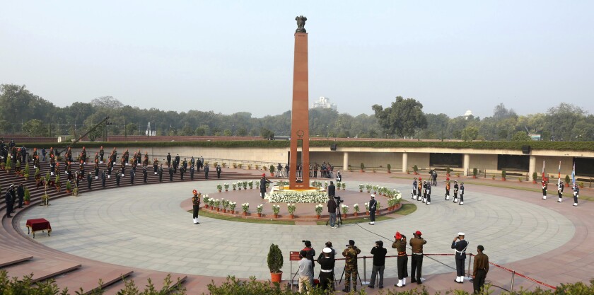 This handout photograph provided by the Indian Army shows a flame being lit at the war memorial in New Delhi, India, Friday, Jan. 21, 2022. Indian Prime Minister Narendra Modi’s government came under fire from the opposition on Friday for shifting "an eternal flame” honoring Indian soldiers killed in the 1971 war with Pakistan to a new National War Memorial he inaugurated nearly three years ago. Rahul Gandhi, a top Congress party leader, accused the government of “removing history” by extinguishing the flame at the India Gate. The flame was lit by his grandmother and then Prime Minister Indira Gandhi in 1972. (Indian Army via AP)