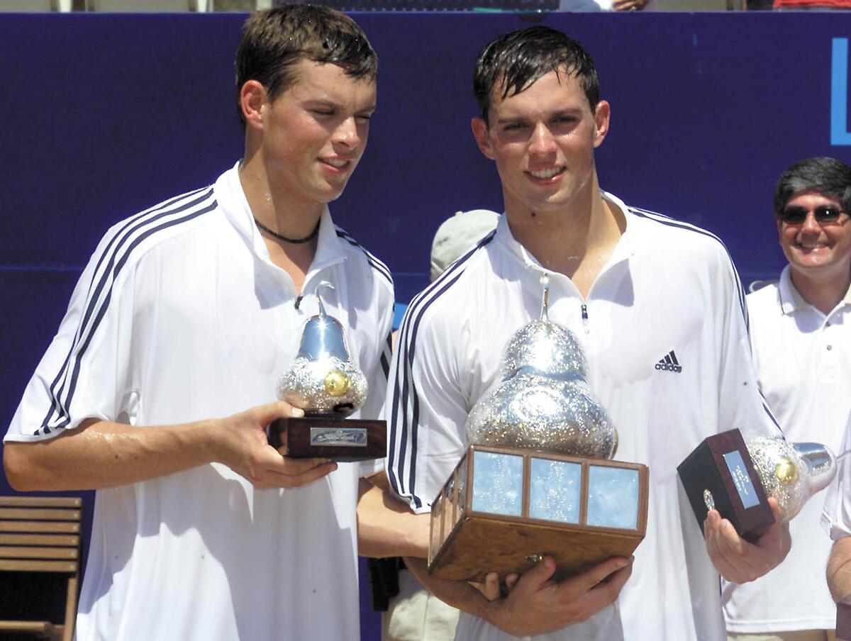 Bob, left, and Mike Bryan celebrate their doubles victory at the 2002 Mexican Open.