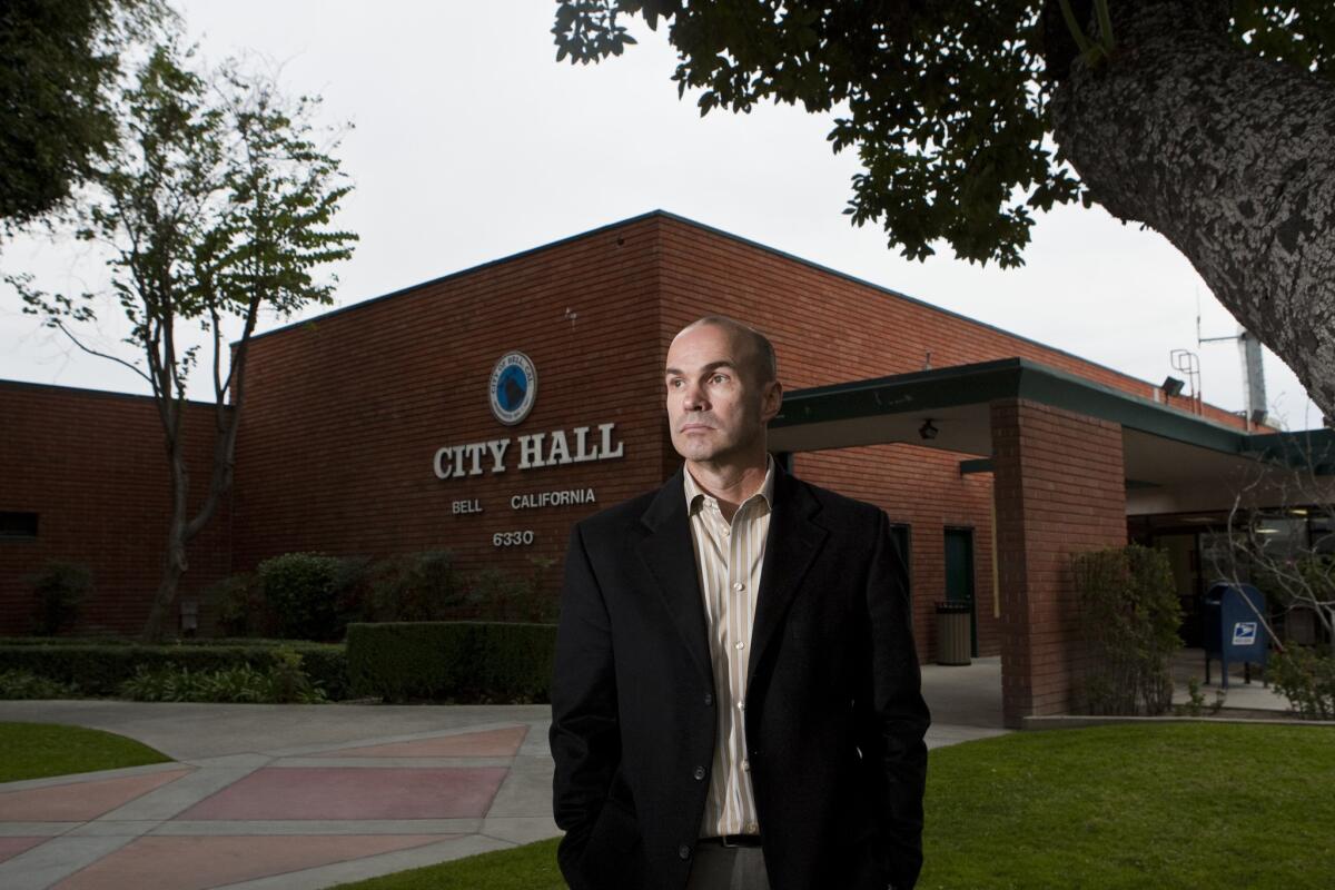 Bell city manager Doug Willmore, shown outside City Hall, acknowledged the city's finances remain rocky but said the situation is not as dire as auditors say.