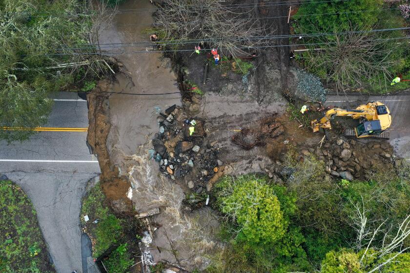  A road washed away on North Main Street of Santa Cruz during atmospheric river in California 