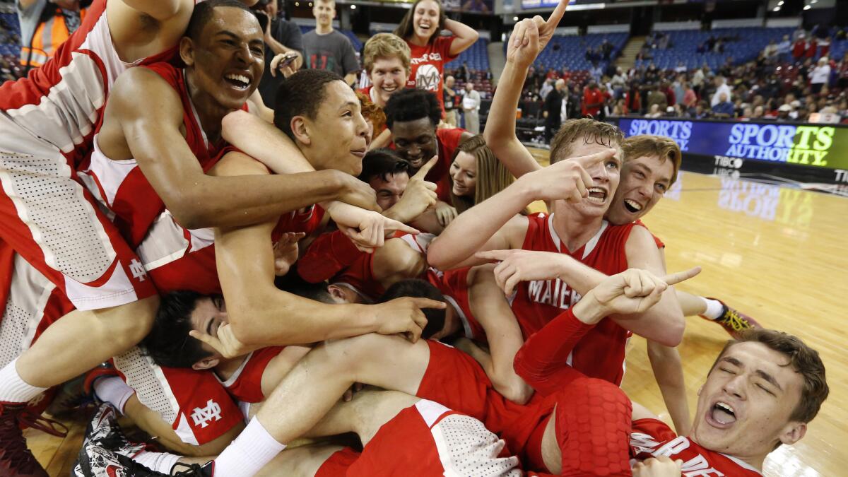 Mater Dei boys' basketball players celebrate their CIF Open Division title victory on March 29, 2014.