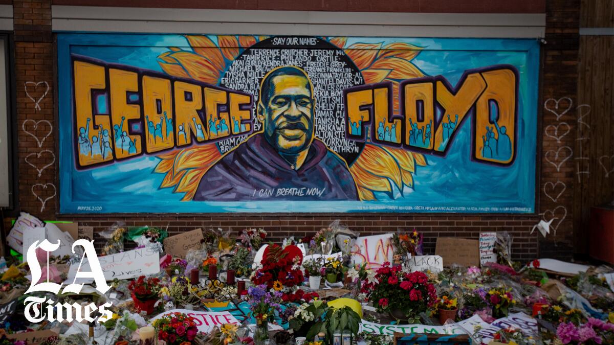 Shown are a makeshift memorial and mural near where George Floyd died while in Minneapolis police custody.