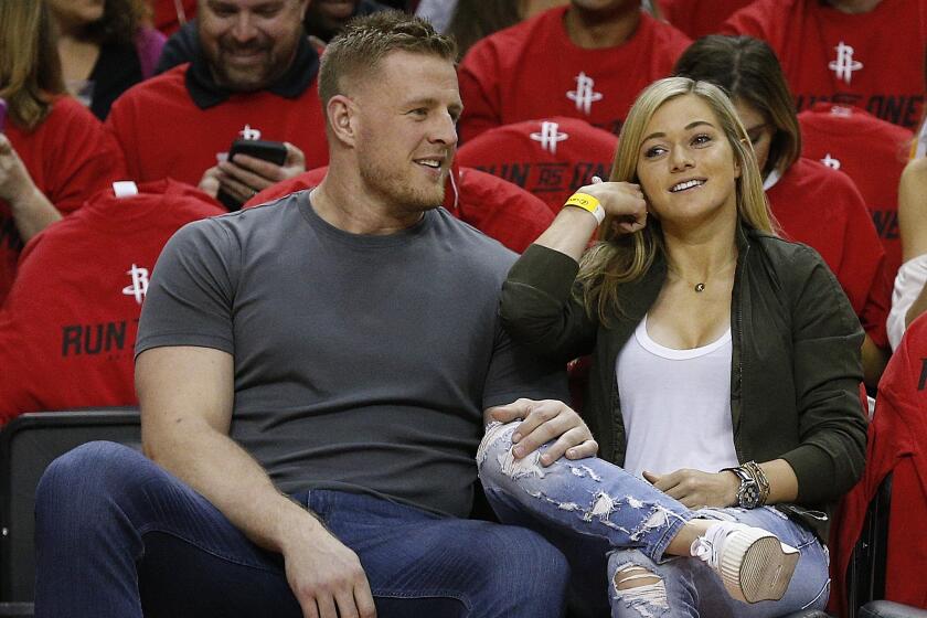 J.J. Watt and Kealia Ohai courtside attend a Houston Rockets game on April 16, 2017, at Toyota Center.