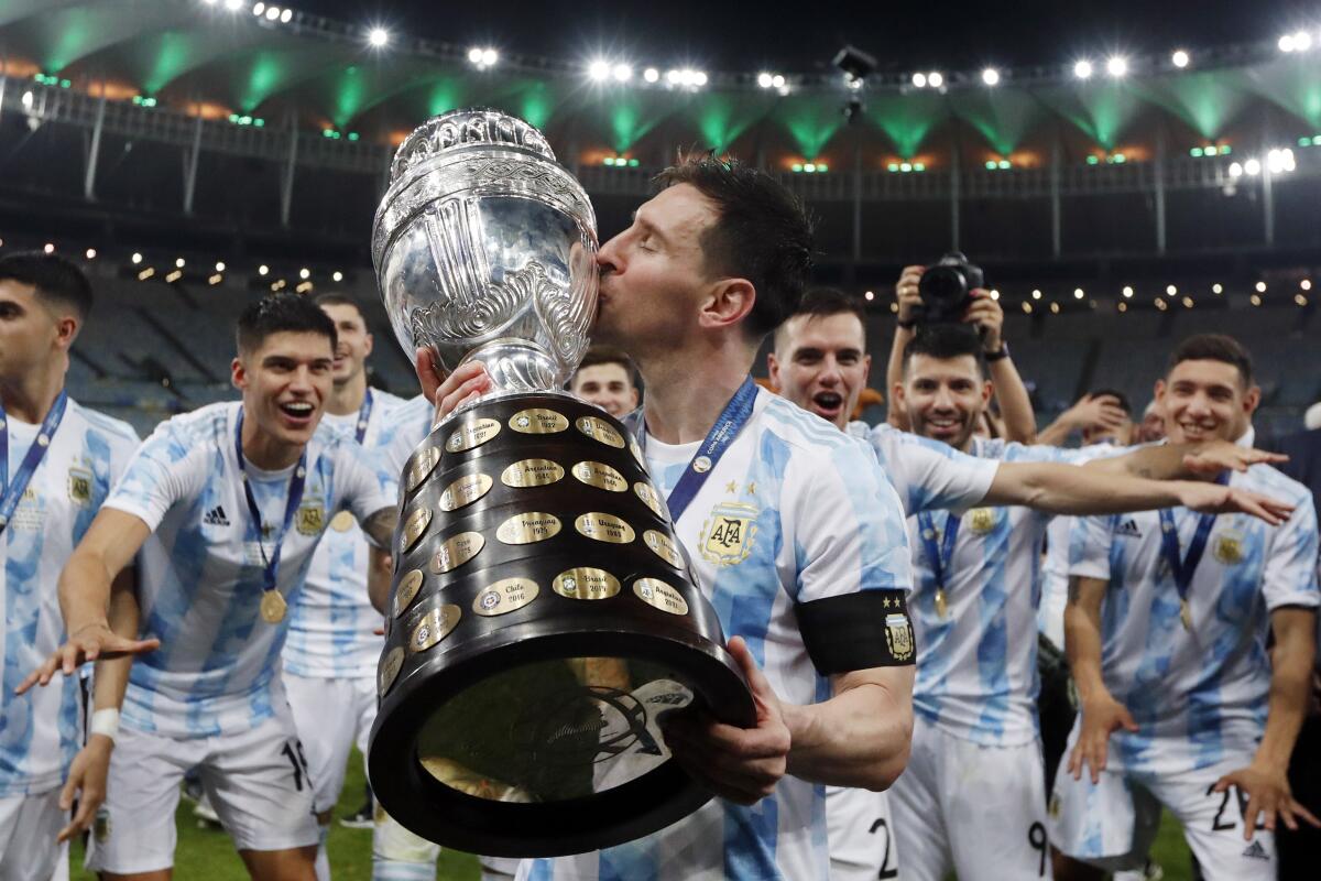 Lionel Messi celebrates with teammates after Argentina's victory over Brazil in the 2021 Copa America tournament.