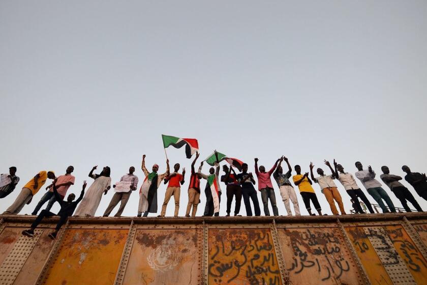 TOPSHOT - Sudanese protesters gather outside the army headquarters in Khartoum on May 6, 2019. - Defiant Sudanese protesters broke their fast on the first day of Ramadan today with chicken soup and beans, vowing to press on with their campaign for a civilian rule. As the call for the evening Maghreb prayer echoed, crowds of protesters gathered at the sit-in area in central Khartoum for iftar after a day of sweltering heat, an AFP correspondent reported. (Photo by Mohamed el-Shahed / AFP)MOHAMED EL-SHAHED/AFP/Getty Images ** OUTS - ELSENT, FPG, CM - OUTS * NM, PH, VA if sourced by CT, LA or MoD **