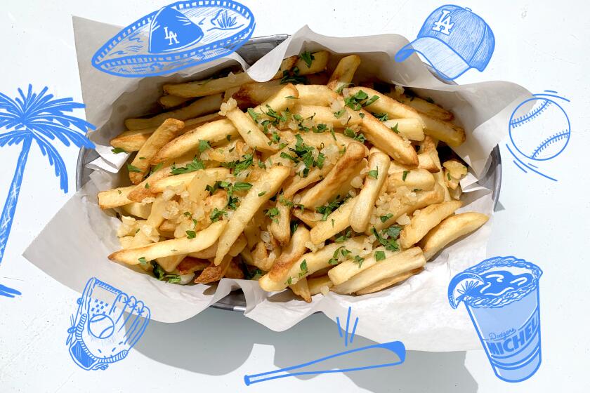 garlic fries in a basket surrounded by illustrations of dodger memorabilia 