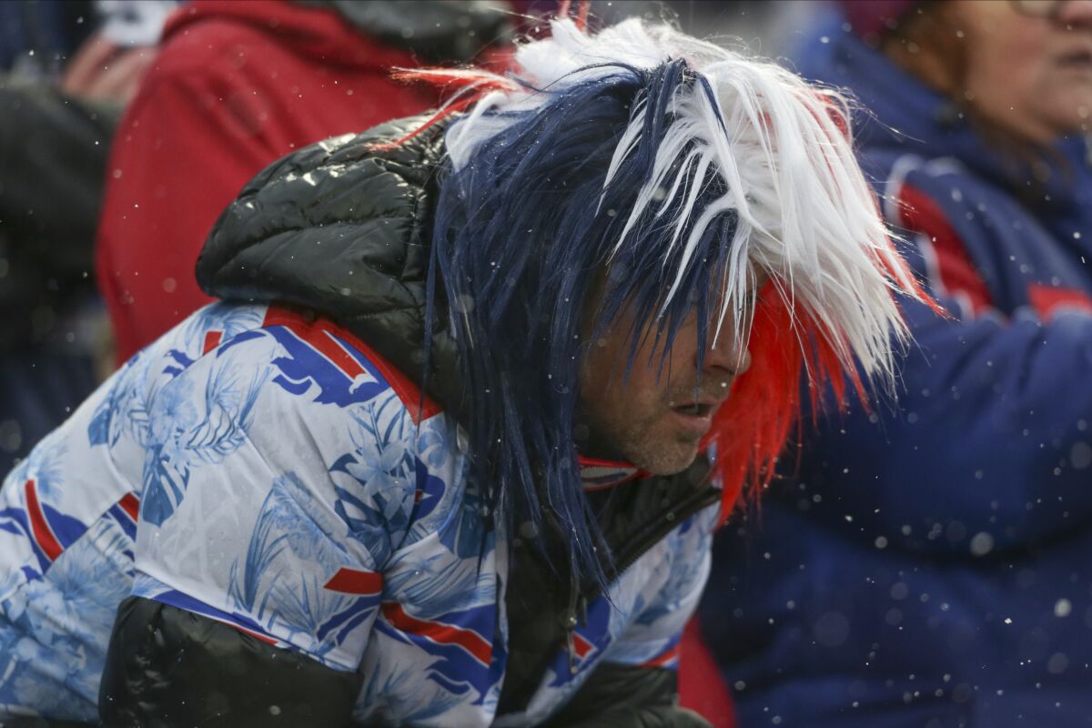 A Buffalo Bills fan reacts during the team's loss to the Cincinnati Bengals in the divisional round of the AFC playoffs.