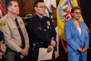 Aug. 2023 photo of (from left) LA County Sheriff Robert Luna, Assistant Chief LAPD Dominic Choi, and L.A. Mayor Karen Bass.