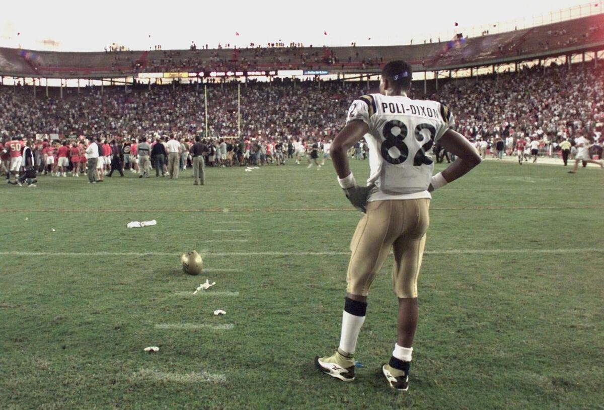 UCLA's Brian Poli–Dixon is dejected as he watches Miami celebrate on the field at the Orange Bowl on Dec. 5, 1998.