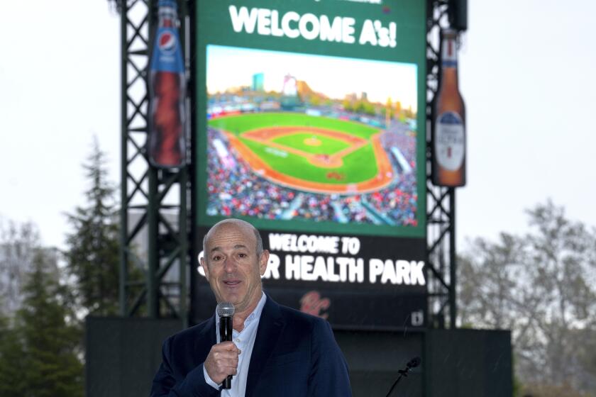 John Fisher, owner of the Oakland Athletics baseball team, announces that his team will leave Oakland after this season and play temporarily at a minor league park, during a news conference in West Sacramento, Calif., Thursday, April 4, 2024. The A's announced the decision to play at the home of the Sacramento River Cats from 2025-27 with an option for 2028 on Thursday after being unable to reach an agreement to extend their lease in Oakland during that time. (AP Photo/Rich Pedroncelli)