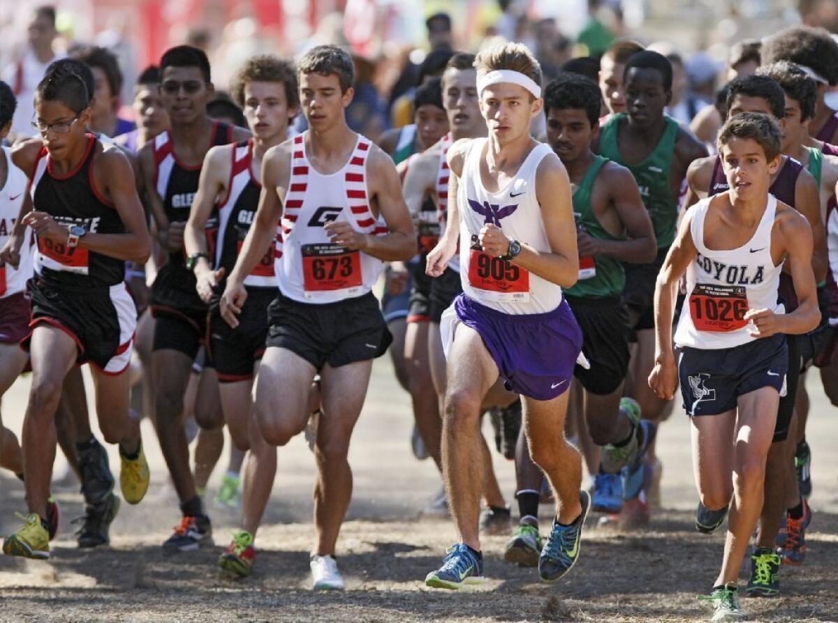 Hoover High's Vladimir Climasevschii, center right, took seventh in his race at the Bellarmine-Jefferson Cross-Country Invitational.