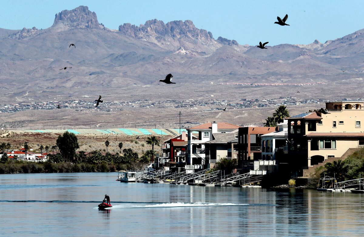 Homes line the banks of the Colorado River in Bullhead City, Ariz.
