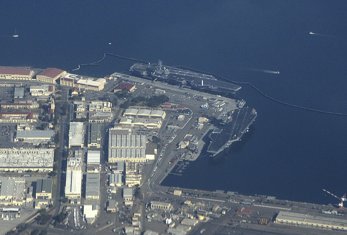 FILE - The U.S. Navy Aircraft carriers USS Ronald Reagan (CVN-76) left, and USS Nimitz (CVN-68) are seen docked at Naval Air Station North Island in San Diego Bay, on Sunday, Jan. 21, 2007. The main entrance to North Island Naval Air Station near San Diego was shut down after a motorist was found with bomb-making materials. A military spokesman says the vehicle approached the gate around 9 a.m. and was stopped and searched at the request of Naval Criminal Investigative Service officials. (AP Photo/Dr. Scott M. Lieberman,File)