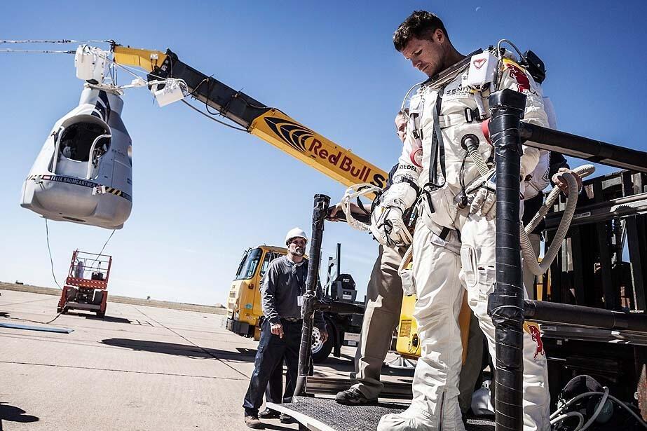 Austrian daredevil Felix Baumgartner leaves the launch area in Roswell, N.M., after his mission -- in which he would step from a balloon-borne capsule 23 miles above the Earth and free fall and parachute to the ground -- was again aborted because of high winds.