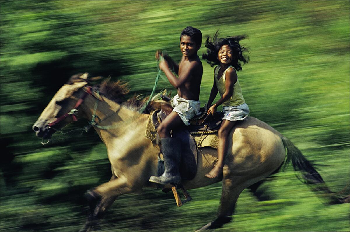 Two kids from Chiapas riding a very fast horse horse