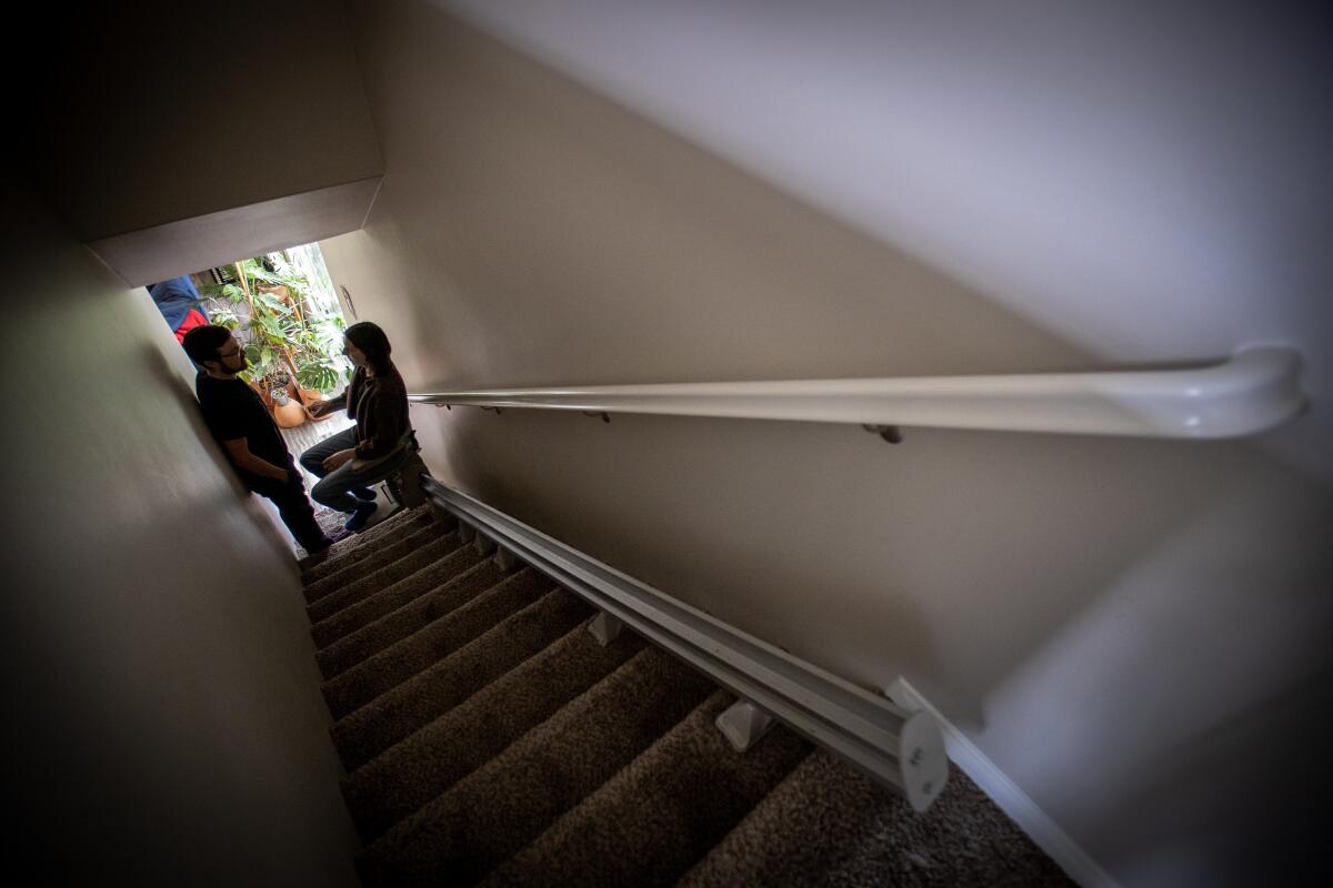 A couple at a home, where one partner has long COVID. 