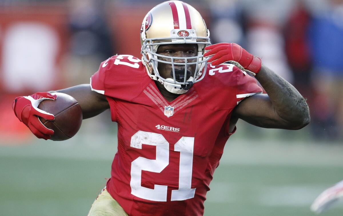 San Francisco 49ers running back Frank Gore runs against the Arizona Cardinals during a Dec. 28 game in Santa Clara, Calif.