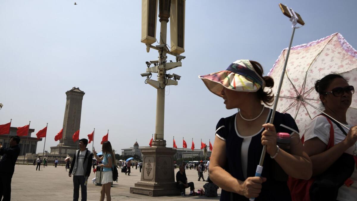 An array of security cameras monitors Tiananmen Square in Beijing.